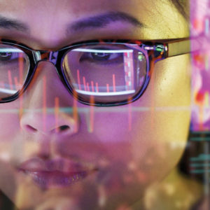 Woman with glasses superimposed on computer screen image